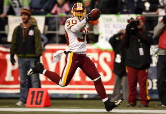 SEATTLE - JANUARY 05:  Safety LaRon Landry #30 of the Washington Redskins celebrates after intercepting a pass in the fourth quarter against the Seattle Seahawks during the NFC Wild Card game at Qwest Field on January 5, 2008 in Seattle, Washington.  (Photo by Otto Greule Jr/Getty Images)