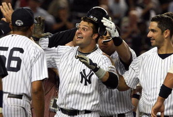 NEW YORK - SEPTEMBER 08:  Nick Swisher #33 of the New York Yankees celebrates his game-winning home run against the Tampa Bay Rays with his teammates on September 8, 2009 at Yankee Stadium in the Bronx borough of New York City. The Yankees won the game 3-2.  (Photo by Jim McIsaac/Getty Images)