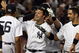 NEW YORK - SEPTEMBER 08: Nick Swisher #33 of the New York Yankees celebrates his game-winning home run against the Tampa Bay Rays with his teammates on September 8, 2009 at Yankee Stadium in the Bronx borough of New York City. The Yankees won the game 3-2. (Photo by Jim McIsaac/Getty Images)