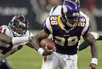 HOUSTON - AUGUST 31:  Running back Adrian Peterson #28 of the Minnesota Vikings breaks a tackle by cornerback Brice McCain #41 of the Houston Texans at Reliant Stadium on August 31, 2009 in Houston, Texas.  (Photo by Bob Levey/Getty Images)