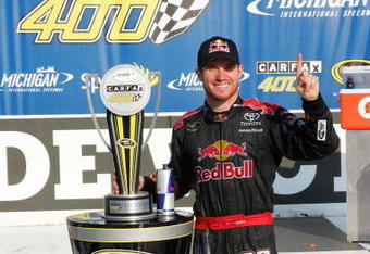 BROOKLYN, MI - AUGUST 16:  Brian Vickers, driver of the #83 Red Bull Toyota, celebrates in victory lane after winning the NASCAR Sprint Cup Series CARFAX 400 at Michigan International Speedway on August 16, 2009 in Brooklyn, Michigan.  (Photo by Jerry Markland/Getty Images for NASCAR)