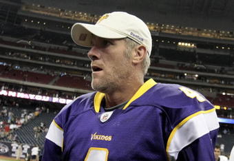 HOUSTON - AUGUST 31:  Quarterback Brett Favre #4 of the Minnesota Vikings leaves the field after leading the Vikings to a 17-10 win over the Houston Texans at Reliant Stadium on August 31, 2009 in Houston, Texas.  (Photo by Bob Levey/Getty Images)
