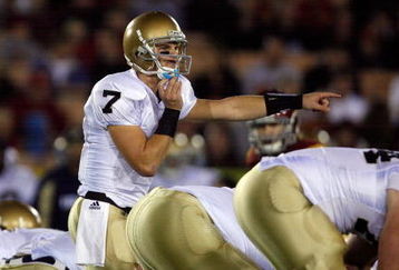 LOS ANGELES, CA - NOVEMBER 29:  Jimmy Clausen #7 of the Notre Dame Fighting Irish calls a play against the USC Trojans during the game at the Coliseum on November 29, 2008 in Los Angeles, California.  (Photo by Harry How/Getty Images)