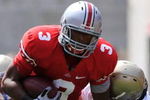 COLUMBUS, OH - SEPTEMBER 05:  Running back Brandon Saine #3 of the Ohio State Buckeyes fights off a tackle by the Navy Midshipmen at Ohio Stadium on September 5, 2009 in Columbus, Ohio.  (Photo by Jamie Sabau/Getty Images)