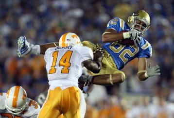 PASADENA, CA - SEPTEMBER 01:  Taylor Embree #82 of the UCLA Bruins makes a catch for a first down in front of Eric Berry #14 of the Tennessee Volunteers during the fourth quarter at the Rose Bowl on September 1, 2008 in Pasadena, California.  (Photo by Harry How/Getty Images)