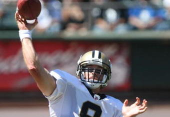 OAKLAND, CA - AUGUST 29: Quarterback Drew Brees #9 of the New Orleans Saints delivers a pass during the preseason game against the Oakland Raiders at Oakland-Alameda County Coliseum on August 29, 2009 in Oakland, California. (Photo by Jed Jacobsohn/Getty Images)