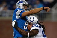 DETROIT, MI - AUGUST 28: Quarterback Matthew Stafford #9 of the Detroit Lions is tackled by defensive end Marcus Howard #92 of the Indianapolis Colts at Ford Field on August 28, 2009 in Detroit, Michigan.  (Photo by Scott Boehm/Getty Images)