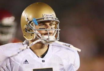 LOS ANGELES - NOVEMBER 29:  Jimmy Clausen #7 of the Notre Dame Fighting Irish walks on the field against the USC Trojans on November 29, 2008 at the Los Angeles Memorial Coliseum in Los Angeles, California.  USC won 38-3.  (Photo by Jeff Golden/Getty Images)