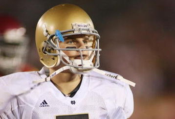 LOS ANGELES - NOVEMBER 29:  Jimmy Clausen #7 of the Notre Dame Fighting Irish walks on the field against the USC Trojans on November 29, 2008 at the Los Angeles Memorial Coliseum in Los Angeles, California.  USC won 38-3.  (Photo by Jeff Golden/Getty Images)