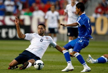 SANDY, UT - SEPTEMBER 05:  Clint Dempsey #8 of the United States slides to get the ball against Marvin Gonzales #3 during the FIFA 2010 World Cup Qualifier match between the United States and El Salvador at Rio Tinto Stadium on September 5, 2009 in Sandy, Utah.  (Photo by Jonathan Ferrey/Getty Images)
