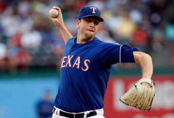 ARLINGTON, TX - JULY 29:  Pitcher Scott Feldman #39 of the Texas Rangers throws against the Detroit Tigers on July 29, 2009 at Rangers Ballpark in Arlington, Texas.  (Photo by Ronald Martinez/Getty Images)