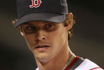 BOSTON - SEPTEMBER 08:  Clay Buchholz #61 of the Boston Red Sox heads into the dugout after pitching seven shutout innings against the Baltimore Orioles on September 8, 2009 at Fenway Park in Boston, Massachusetts.  (Photo by Elsa/Getty Images)