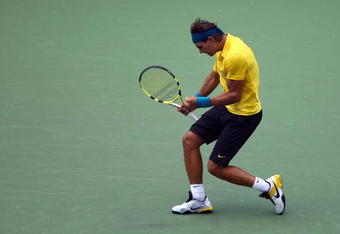NEW YORK - SEPTEMBER 06:  Rafael Nadal of Spain reacts to a point against Nicolas Almagro of Spain during day seven of the 2009 U.S. Open at the USTA Billie Jean King National Tennis Center on September 6, 2009 in the Flushing neighborhood of the Queens borough of New York City.  (Photo by Julian Finney/Getty Images)
