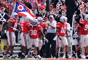 COLUMBUS, OH - SEPTEMBER 05:  Ohio State Buckeyes players congratulate Brian Rolle #36 of the Buckeyes after Rolle intercepted a Navy Midshipmen two-point conversion attempt and returned it 100 yards to the Navy endzone at Ohio Stadium on September 5, 2009 in Columbus, Ohio. Ohio State was granted the two points and held off Navy 31-27.  (Photo by Jamie Sabau/Getty Images)