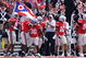 COLUMBUS, OH - SEPTEMBER 05:  Ohio State Buckeyes players congratulate Brian Rolle #36 of the Buckeyes after Rolle intercepted a Navy Midshipmen two-point conversion attempt and returned it 100 yards to the Navy endzone at Ohio Stadium on September 5, 2009 in Columbus, Ohio. Ohio State was granted the two points and held off Navy 31-27.  (Photo by Jamie Sabau/Getty Images)