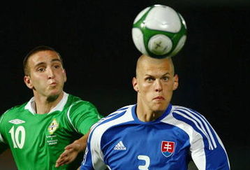 BELFAST, NORTHERN IRELAND - SEPTEMBER 09:  Martin Skrtel (R) of Slovakia controls the ball ahead of Martin Paterson of Northern Ireland during the FIFA 2010 Group 3 World Cup Qualifier between Northern Ireland and Slovakia at Windsor Park on September 9, 2009 in Belfast, Northern Ireland. (Photo by Richard Heathcote/GettyImages)