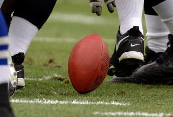 A loose ball bounds on the turf as the Jacksonville Jaguars host the Indianapolis Colts  December 11, 2005 in Jacksonville.  The Colts defeated the Jaguars 26 - 18 to remain undefeated.  (Photo by Al Messerschmidt/Getty Images)