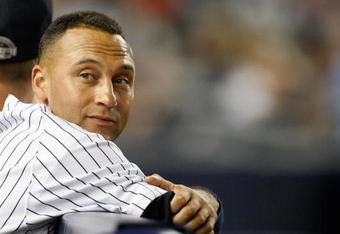 NEW YORK - SEPTEMBER 07:  Derek Jeter #2 of the New York Yankees watches the game from the dugout during the game against the Tampa Bay Rays on September 7, 2009 at Yankee Stadium in the Bronx borough of New York City.  (Photo by Jared Wickerham/Getty Images)