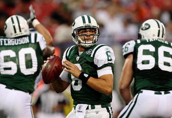 EAST RUTHERFORD, NJ - SEPTEMBER 3:  Quarterback Mark Sanchez #6 of the New York Jets looks to make a pass play in the first quarter against the Philadelphia Eagles during the NFL preseason game at Giants Stadium on September 3, 2009 in East Rutherford, New Jersey. (Photo by Jim McIsaac/Getty Images)