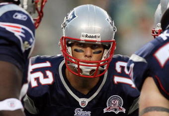 PHILADELPHIA - AUGUST 13:  Tom Brady #12 of the New England Patriots huddles with his teammates against the Philadelphia Eagles on August 13, 2009 at Lincoln Financial Field in Philadelphia, Pennsylvania.  (Photo by Jim McIsaac/Getty Images)