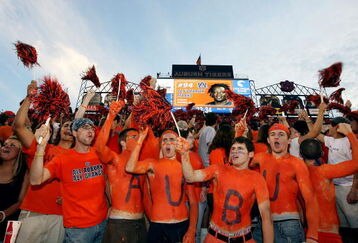 AUBURN, AL - SEPTEMBER 20: Auburn fans cheer as defensive lineman Sen'Derrick Marks #94 of the Auburn Tigers is announced prior to taking on the LSU Tigers missed a field goal at Jordan-Hare Stadium on September 20, 2008 in Auburn, Alabama. (Photo by Doug Benc/Getty Images)