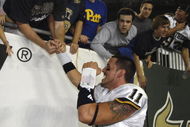 TAMPA, FL - OCTOBER 2:  Quarterback Bill Stull #11 of the Pittsburgh Panthers celebrates with fans an upset win against the University of South Florida Bulls at Raymond James Stadium on October 2, 2008 in Tampa, Florida.  (Photo by Al Messerschmidt/Getty Images)