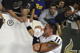 TAMPA, FL - OCTOBER 2:  Quarterback Bill Stull #11 of the Pittsburgh Panthers celebrates with fans an upset win against the University of South Florida Bulls at Raymond James Stadium on October 2, 2008 in Tampa, Florida.  (Photo by Al Messerschmidt/Getty Images)