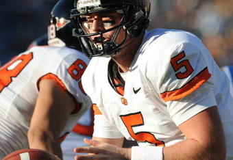 PASADENA, CA - NOVEMBER 08:   Sean Canfield #5 of the Oregon State Beavers passes off the ball during the game against the UCLA Bruins at the Pasadena Rose Bowl on November 8, 2008 in Pasadena, California.  (Photo by Lisa Blumenfeld/Getty Images)
