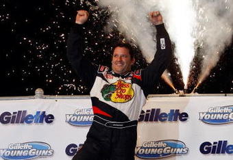 ROSSBURG, OH - SEPTEMBER 09:  Tony Stewart, driver of the #14 celebrates after winning the Gillette Young Guns Prelude to the Dream at Eldora Speedway on September 9, 2009 in Rossburg, Ohio.  (Photo by Chris Graythen/Getty Images for True Speed Communication)