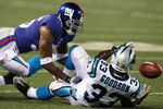 EAST RUTHERFORD, NJ - AUGUST 17:  Mike Goodson #33 of the Carolina Panthers attempts a catch against Travonti Johnson #36 of the New York Giants during the preseason NFL game at Giants Stadium on August 17, 2009 in East Rutherford, New Jersey. (Photo by Jim McIsaac/Getty Images)