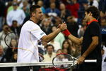 NEW YORK - SEPTEMBER 09:  Roger Federer (L) of Switzerland shakes hands with Robin Soderling of Sweden after defeating Soderling during day ten of the 2009 U.S. Open at the USTA Billie Jean King National Tennis Center on September 9, 2009 in the Flushing neighborhood of the Queens borough of New York City.  (Photo by Chris McGrath/Getty Images)