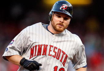 ARLINGTON, TX - JULY 17:  Jason Kubel #16 of the Minnesota Twins runs the bases after hitting a three run homerun against the Texas Ranges on July 17, 2009 at Rangers Ballpark in Arlington, Texas.  (Photo by Ronald Martinez/Getty Images)