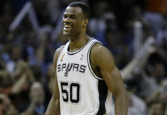 SAN ANTONIO, TX - JUNE 15:  David Robinson #50 of the San Antonio Spurs celebrates in game six of the 2003 NBA Finals against the New Jersey Nets on June 15, 2003 at the SBC Center in San Antonio, Texas.  The Spurs won 88-77 and defeated the Nets to win the NBA Championship.  NOTE TO USER: User expressly acknowledges and agrees that, by downloading and/or using this Photograph, User is consenting to the terms and conditions of the Getty Images License Agreement.  (Photo by Ezra Shaw/Getty Images)