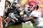 IOWA CITY, IA - SEPTEMBER 16: Running back Damian Sims #28 of the Iowa Hawkeyes runs with the football as linebacker Alvin Bowen #15 of the Iowa State Cyclones pursues at Kinnick Stadium on September 16, 2006 in Iowa City, Iowa. The Hawkeyes defeated Cyclones 27-17. (Photo by Scott Boehm/Getty Images)