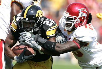 IOWA CITY, IA - SEPTEMBER 16: Running back Damian Sims #28 of the Iowa Hawkeyes runs with the football as linebacker Alvin Bowen #15 of the Iowa State Cyclones pursues at Kinnick Stadium on September 16, 2006 in Iowa City, Iowa. The Hawkeyes defeated Cyclones 27-17. (Photo by Scott Boehm/Getty Images)