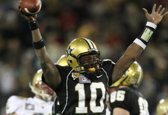 NASHVILLE, TN - DECEMBER 31:  Larry Smith #10 of the Vanderbilt Commodores celebrates against the Boston College Eagles during the Gaylord Hotels Music City Bowl at LP Field on December 31, 2008 in Nashville, Tennessee.  (Photo by Andy Lyons/Getty Images)