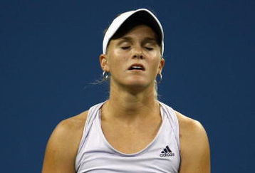 NEW YORK - SEPTEMBER 09:  Melanie Oudin of the United States reacts to a play during her match against Caroline Wozniacki of Denmark during day ten of the 2009 U.S. Open at the USTA Billie Jean King National Tennis Center on September 9, 2009 in the Flushing neighborhood of the Queens borough of New York City.  (Photo by Chris McGrath/Getty Images)