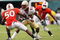 MIAMI - OCTOBER 04:  Wide receiver Taiwan Easterling #82 of the Florida State Seminoles tries to avoid being brought down by linebacker Darryl Sharpton #50 and defensive back Brandon Harris #1 of the Miami Hurricanes at Dolphin Stadium on October 4, 2008 in Miami, Florida.  (Photo by Doug Benc/Getty Images)