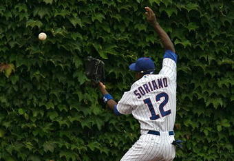 CHICAGO - AUGUST 28: Alfonso Soriano #12 of the Chicago Cubs misses a catch in the outfield against the New York Mets on August 28, 2009 at Wrigley Field in Chicago, Illinois. The Cubs defeated the Mets 5-2. (Photo by Jonathan Daniel/Getty Images) 