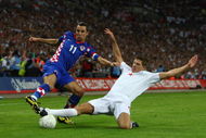 LONDON, ENGLAND - SEPTEMBER 09:  Steven Gerrard of England challenges Darijo Srna of Croatia during the FIFA 2010 World Cup Group 6 Qualifying match between England and Croatia at Wembley Stadium on September 9, 2009 in London, England.  (Photo by Jamie McDonald/Getty Images)
