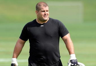 WESTMINSTER, MD - JULY 28:  Kelly Gregg #97 of the Baltimore Ravens walks off the field during training camp at McDaniel College on July 28, 2009 in Westminster, Maryland.  (Photo by Greg Fiume/Getty Images)