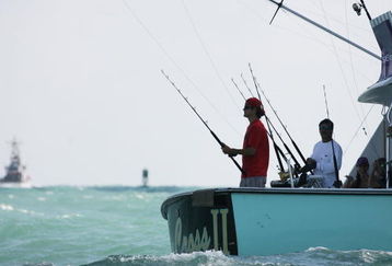 MIAMI - MARCH 26:  Frank Dancevic (red shirt) aboard a charter fishing boat prior to the Sony Ericsson Open on March 26, 2009 in Miami, Florida.  (Photo by Marc Serota/Getty Images for Sony Ericsson)