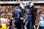 NASHVILLE, TN - DECEMBER 21:  Justin Gage #12 of the Tennessee Titans celebrates with teammate LenDale White #25 after scoring a touchdown against the Pittsburgh Steelers during their game on December 21, 2008 at LP Field in Nashville, Tennessee.  (Photo by Streeter Lecka/Getty Images)