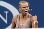 NEW YORK - SEPTEMBER 09:  Caroline Wozniacki of Denmark celebrates after a point against Melanie Oudin of the United States during day ten of the 2009 U.S. Open at the USTA Billie Jean King National Tennis Center on September 9, 2009 in the Flushing neighborhood of the Queens borough of New York City.  (Photo by Jim McIsaac/Getty Images)