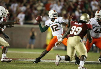 TALLAHASSEE, FL - SEPTEMBER 07:  Quarterback Jacory Harris #12 of the Miami Hurricanes throws a touchdown pass in the fourth quarter to Graig Cooper #2 against the Florida State Seminoles at Doak Campbell Stadium on September 7, 2009 in Tallahassee, Florida. Miami defeated Florida State 38-34.  (Photo by Doug Benc/Getty Images)