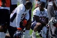 ENGLEWOOD, CO - JUNE 12:  Free agent running back Correll Buckhalter #28 chats with first round draft pick running back Knowshon Moreno #27 of the Denver Broncos during minicamp practice at the Broncos Dove Valley training facility on June 12, 2009 in Englewood, Colorado.  (Photo by Doug Pensinger/Getty Images)