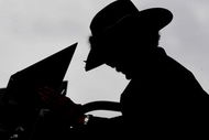 HAMPTON, GA - SEPTEMBER 05:  Former NASCAR champion Richard Petty checks lap times, during practice for the NASCAR Sprint Cup Series Pep Boys Auto 500 at Atlanta Motor Speedway on September 5, 2009 in Hampton, Georgia.  (Photo by Rusty Jarrett/Getty Images for NASCAR)