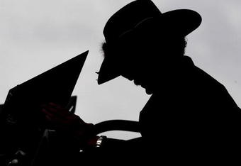 HAMPTON, GA - SEPTEMBER 05:  Former NASCAR champion Richard Petty checks lap times, during practice for the NASCAR Sprint Cup Series Pep Boys Auto 500 at Atlanta Motor Speedway on September 5, 2009 in Hampton, Georgia.  (Photo by Rusty Jarrett/Getty Images for NASCAR)