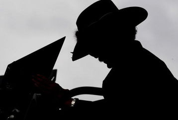 HAMPTON, GA - SEPTEMBER 05:  Former NASCAR champion Richard Petty checks lap times, during practice for the NASCAR Sprint Cup Series Pep Boys Auto 500 at Atlanta Motor Speedway on September 5, 2009 in Hampton, Georgia.  (Photo by Rusty Jarrett/Getty Images for NASCAR)