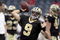 HOUSTON - AUGUST 22:  Quarterback Drew Brees #9 of the New Orleans Saints drops back against the Houston Texans on August 22, 2009 in Houston, Texas.  (Photo by Bob Levey/Getty Images)